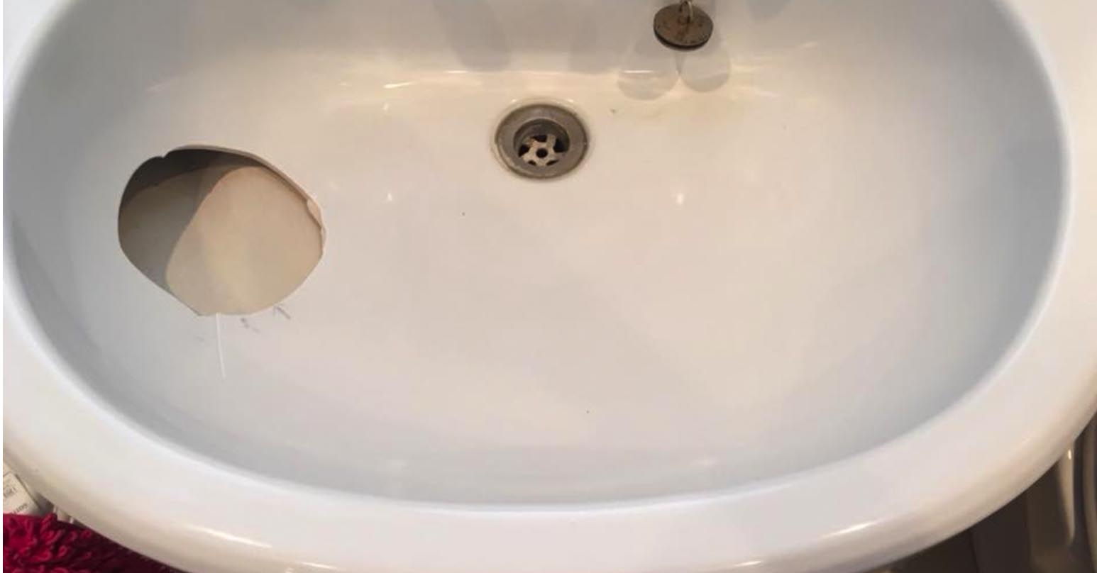 repair hole in bathroom sink